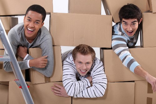 Local moving van loading boxes and furniture near Paddington