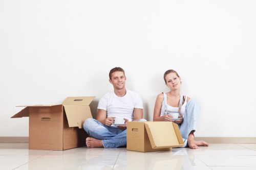 Professional movers loading household items for a Paddington relocation