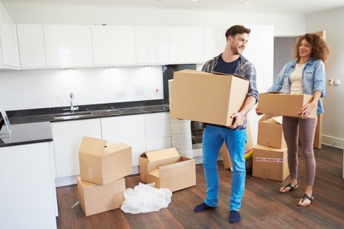 Local moving team handling packing in a Paddington apartment building